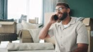 A man on the phone switching realtors as a buyer